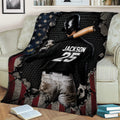 Close lifestyle view of a baseball batter throw blanket displayed across a sofa