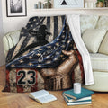 Patriotic softball blanket draped across a sofa with a female batter and star-spangled artwork