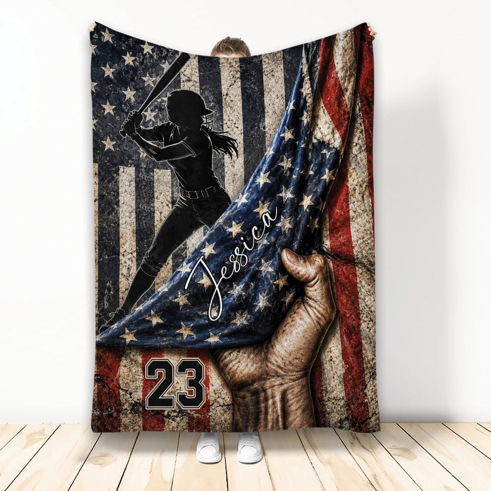 Softball throw blanket featuring a female batter silhouette over a distressed patriotic flag design