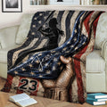 Softball player throw blanket displayed on a couch with vintage American flag artwork