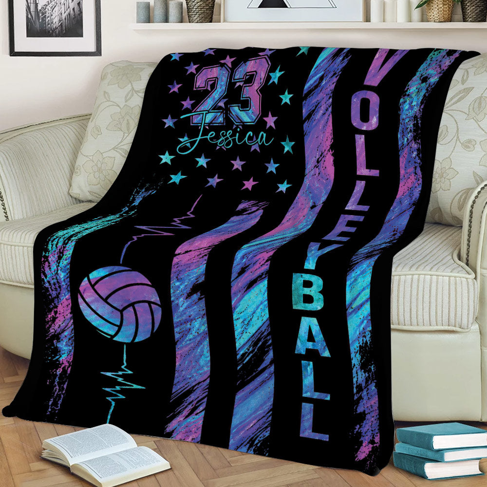 Volleyball throw blanket styled on a couch with vibrant stars, volleyball artwork, and energetic graphics