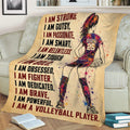 Volleyball blanket draped over a couch with colorful female player artwork and motivational athletic typography