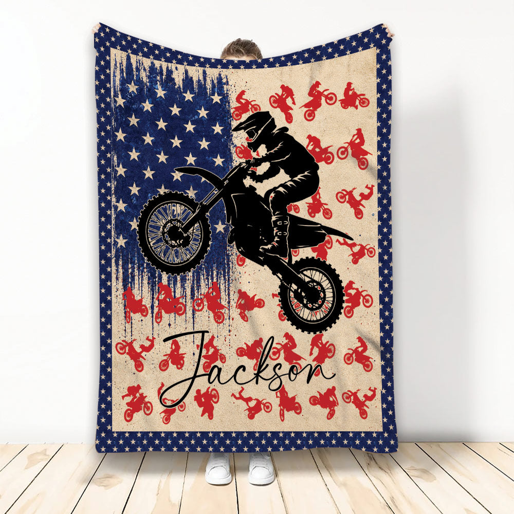 Motocross throw blanket featuring a dirt bike rider, red riding silhouettes, stars and patriotic colors