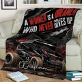 Dirt track racing blanket draped over a couch featuring a dramatic winged race car design