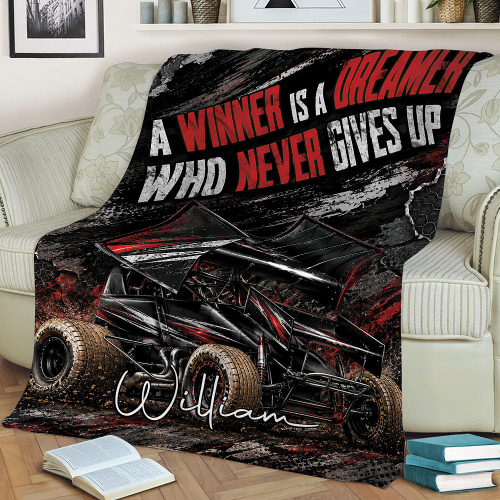 Dirt track racing blanket draped over a couch featuring a dramatic winged race car design