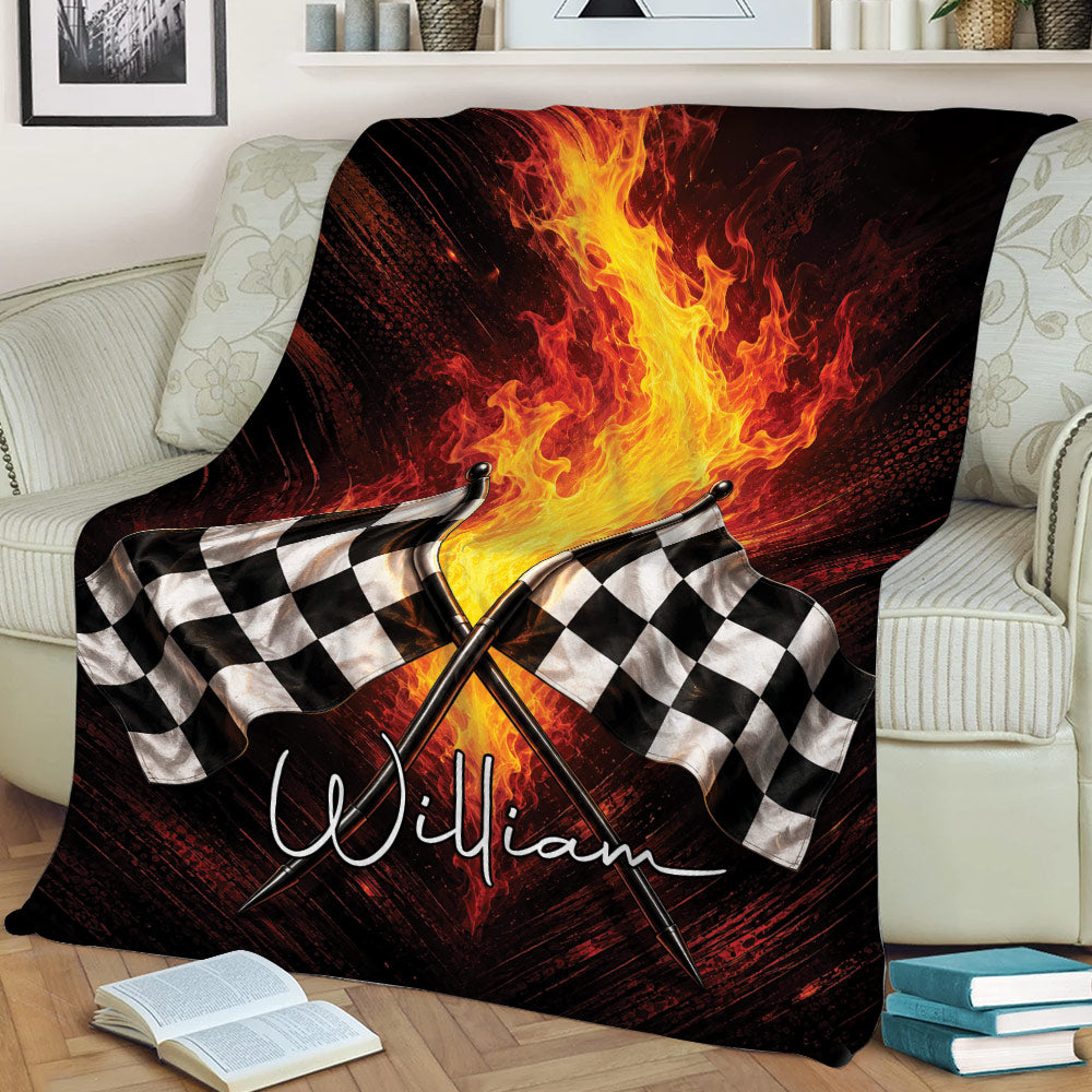 Checkered flag racing blanket with dramatic flames styled across a cozy living room couch