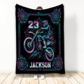 Motocross throw blanket with neon dirt bike rider artwork and ornate purple and blue border