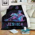 Barrel racing blanket displayed on a couch with vibrant horse and rider artwork in blue and purple tones