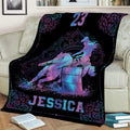 Custom barrel racing throw blanket draped over a sofa with neon horse, rider, and barrel design