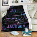 Dirt track sprint car throw blanket draped over a sofa in a cozy living room setting