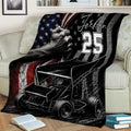 Sprint car dirt track racing blanket displayed on a sofa in a cozy living room