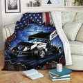 Dirt track racing throw blanket draped over a sofa with bold sprint car artwork