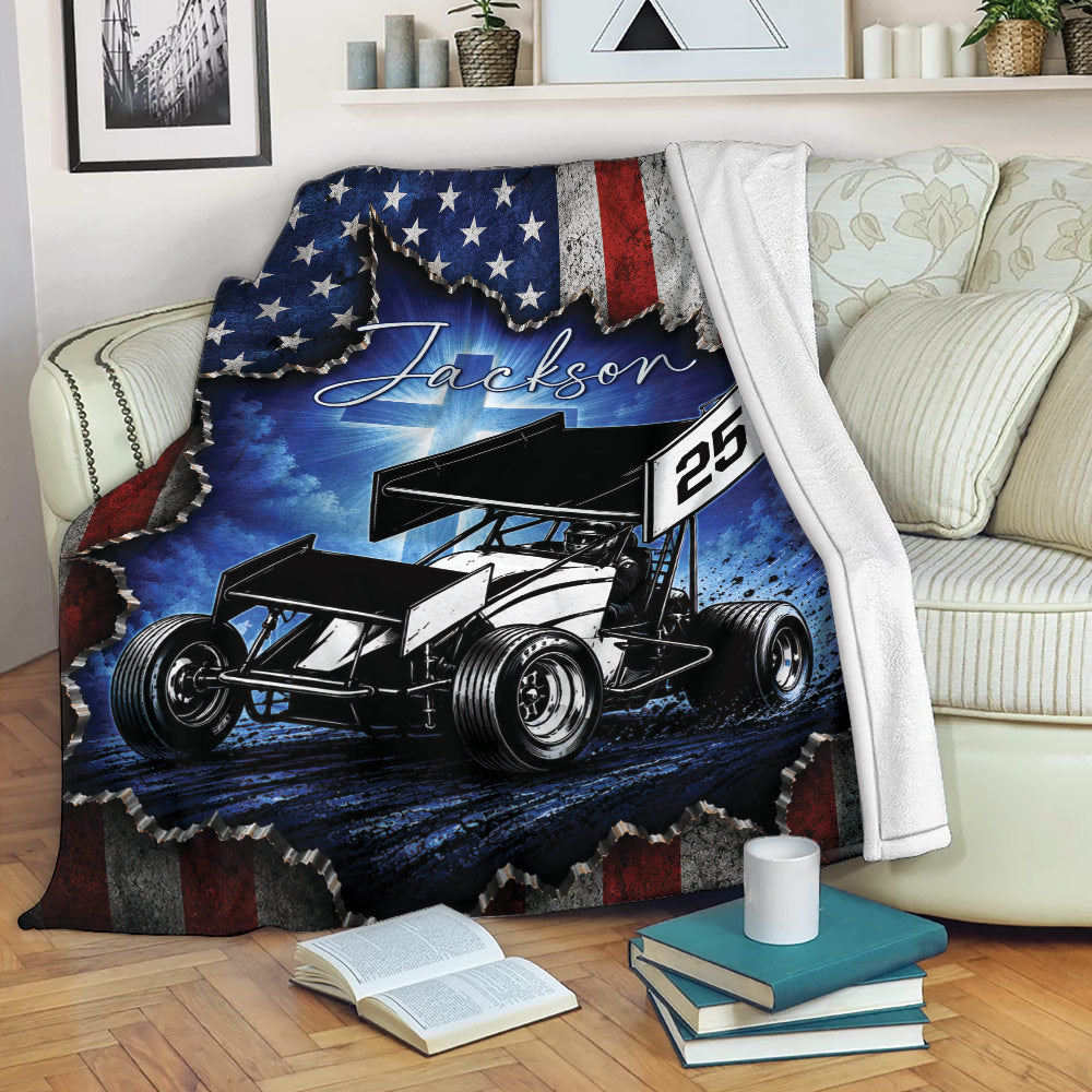 Dirt track racing throw blanket draped over a sofa with bold sprint car artwork