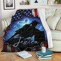 Barrel racing throw blanket displayed on a sofa with western horse and rider artwork