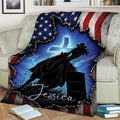 Western barrel racing blanket draped over a couch with horse, rider, barrel, and blue cross artwork