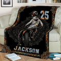 Motocross throw blanket styled on a sofa with dynamic dirt bike rider illustration and bold graphic design