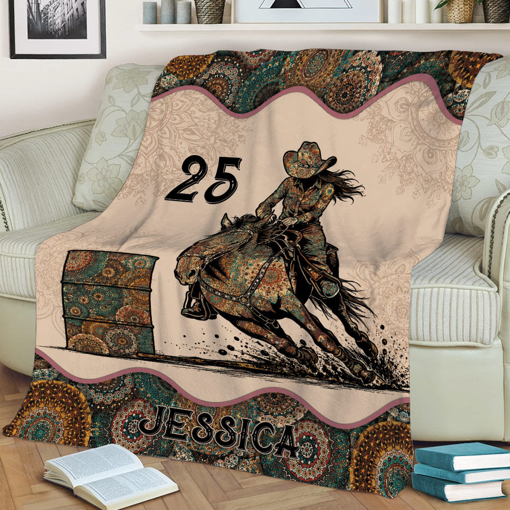 Western barrel racing throw blanket draped over a couch with detailed horse and rider artwork