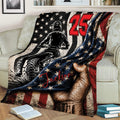Dirt bike motocross throw blanket displayed on a sofa with bold patriotic artwork