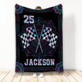 Racing throw blanket with crossed checkered flags and colorful ornate black artwork