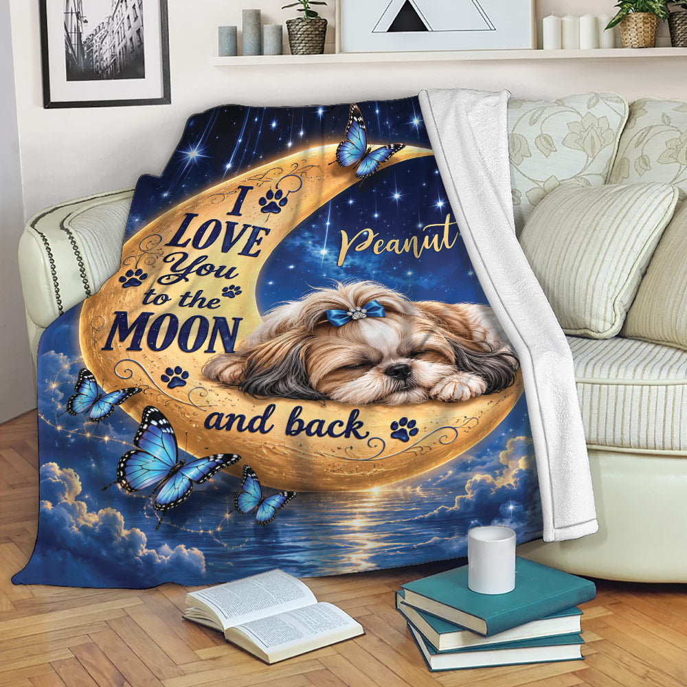 Shih Tzu blanket displayed on a sofa with moon, butterfly, paw print, and starry artwork