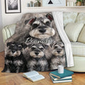 Miniature Schnauzer throw blanket displayed on a sofa with cozy dog artwork and neutral home decor
