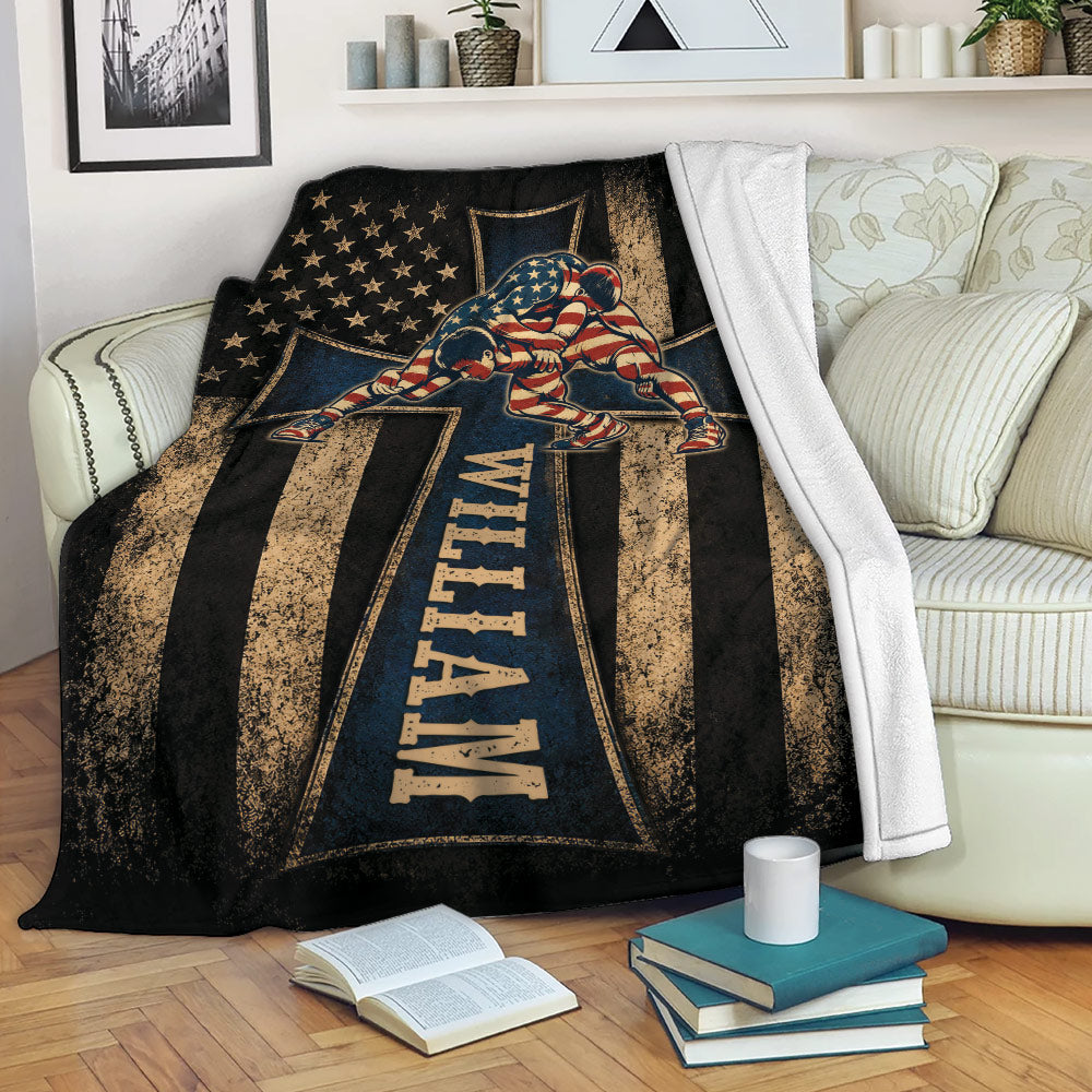Wrestling blanket displayed on a sofa with two wrestlers, patriotic stars and stripes, and distressed vintage artwork