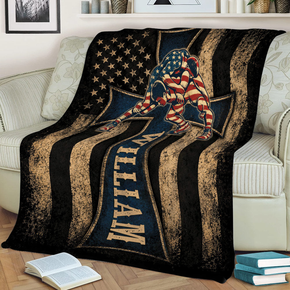 Wrestling throw blanket draped over a couch, featuring two wrestlers and bold distressed patriotic sports artwork