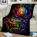 Rainbow LGBT pride blanket draped over a sofa with a vivid rose and Love Is Love design