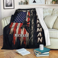 Lineman throw blanket displayed on a sofa with utility worker artwork and patriotic red, white, and blue design