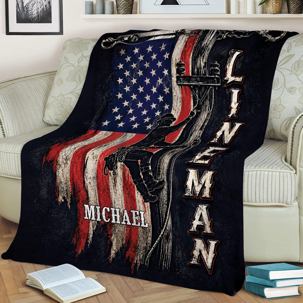 Patriotic lineman blanket draped across a couch with utility pole climber artwork