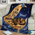 Moonlit German Shepherd throw blanket styled on a couch with paw prints, stars and butterfly details