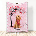 Goldendoodle throw blanket with a heart-covered tree, pink background, and red scarf