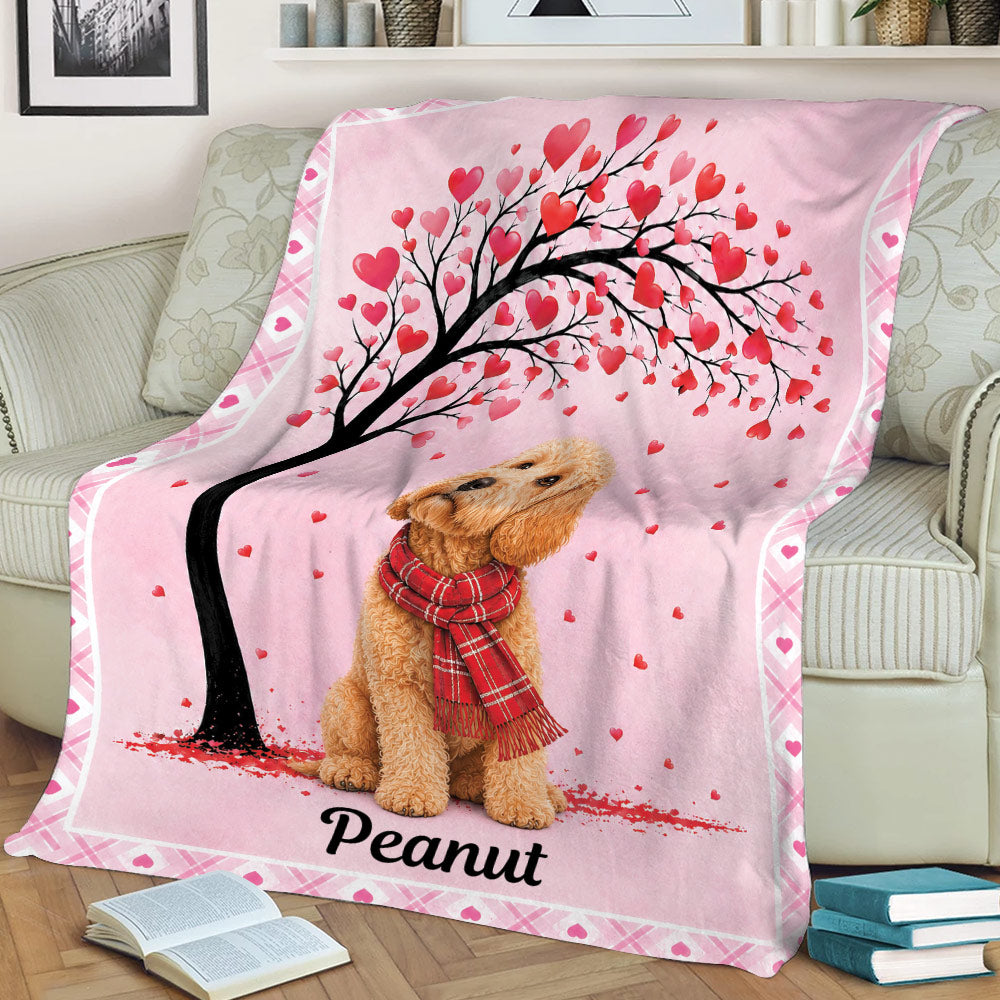 Pink Goldendoodle throw blanket featuring a heart-filled tree and cozy sofa setting