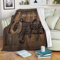 Cowboy blanket displayed on a sofa with Western saddle and rope artwork in a rustic living room