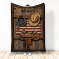 Cowboy blanket featuring a western saddle, hat, lasso, rustic wood, and patriotic flag artwork