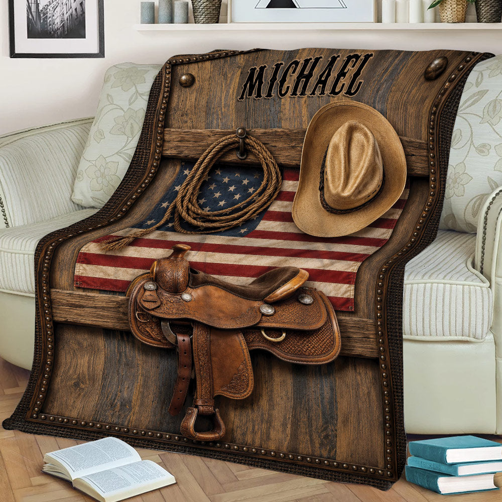 Rustic cowboy blanket draped over a chair with western saddle, hat, lasso, and flag artwork