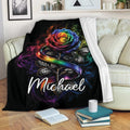 Rainbow pride rose blanket draped over a sofa in a cozy living room setting