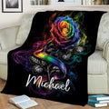 LGBT rainbow rose throw blanket styled across a sofa with vivid pride colors and black floral artwork