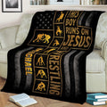 Black and gold wrestling blanket draped over a couch with multiple wrestling silhouettes