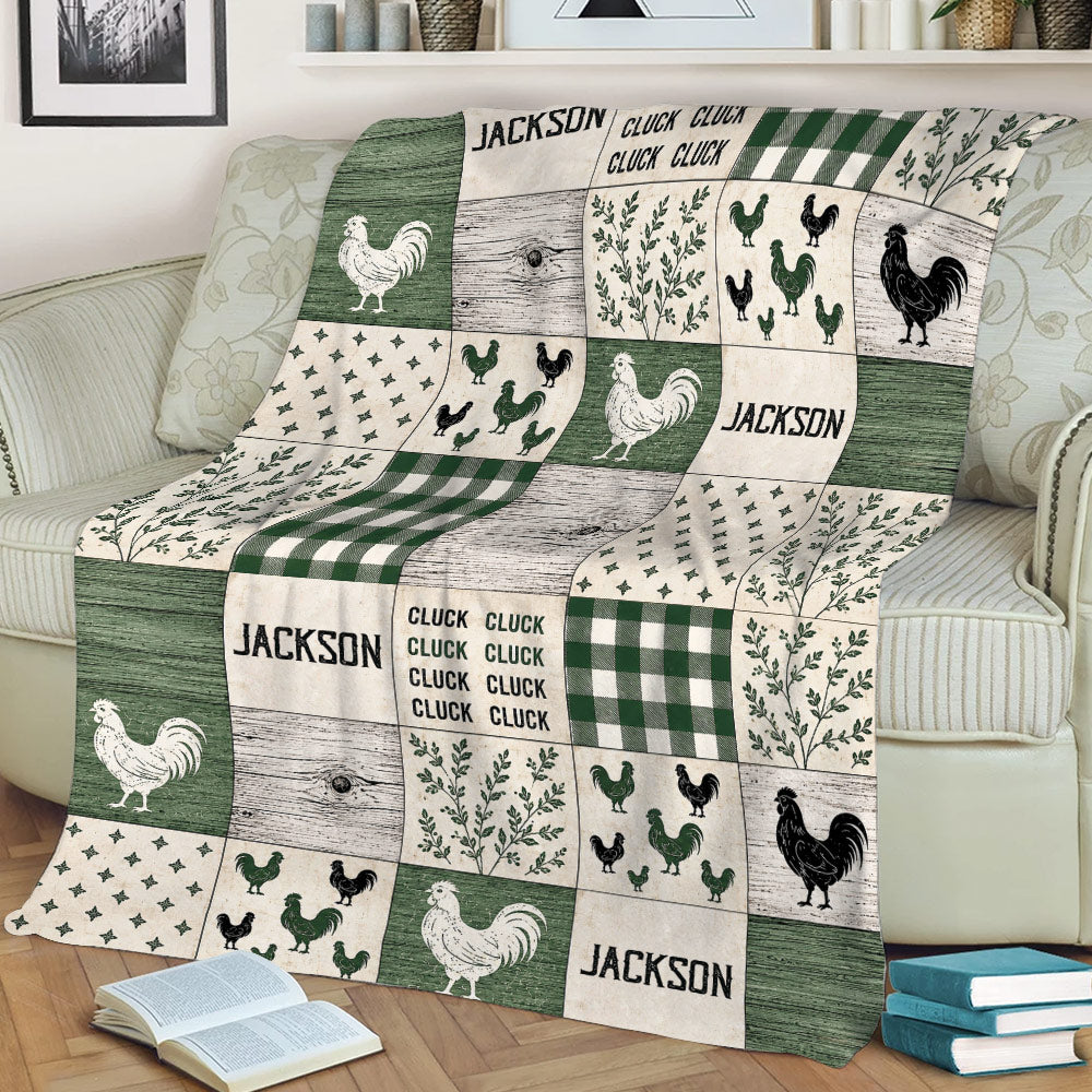 Farmhouse chicken blanket displayed on a couch with rooster illustrations, botanical panels, woodgrain, and green patterns
