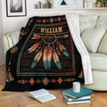 American Native dreamcatcher blanket draped over a sofa with colorful feathers, arrows, and geometric border details