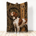 Brittany Spaniel throw blanket displayed with rustic bird-dog artwork and field-inspired hunting decor