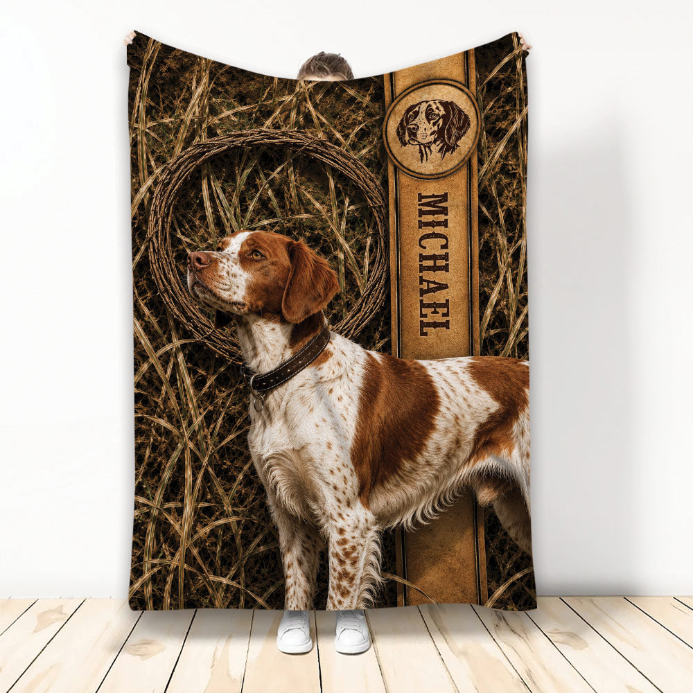 Brittany Spaniel throw blanket displayed with rustic bird-dog artwork and field-inspired hunting decor