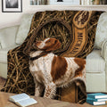 Brittany Spaniel throw blanket spread across a sofa with woodland and bird-dog artwork