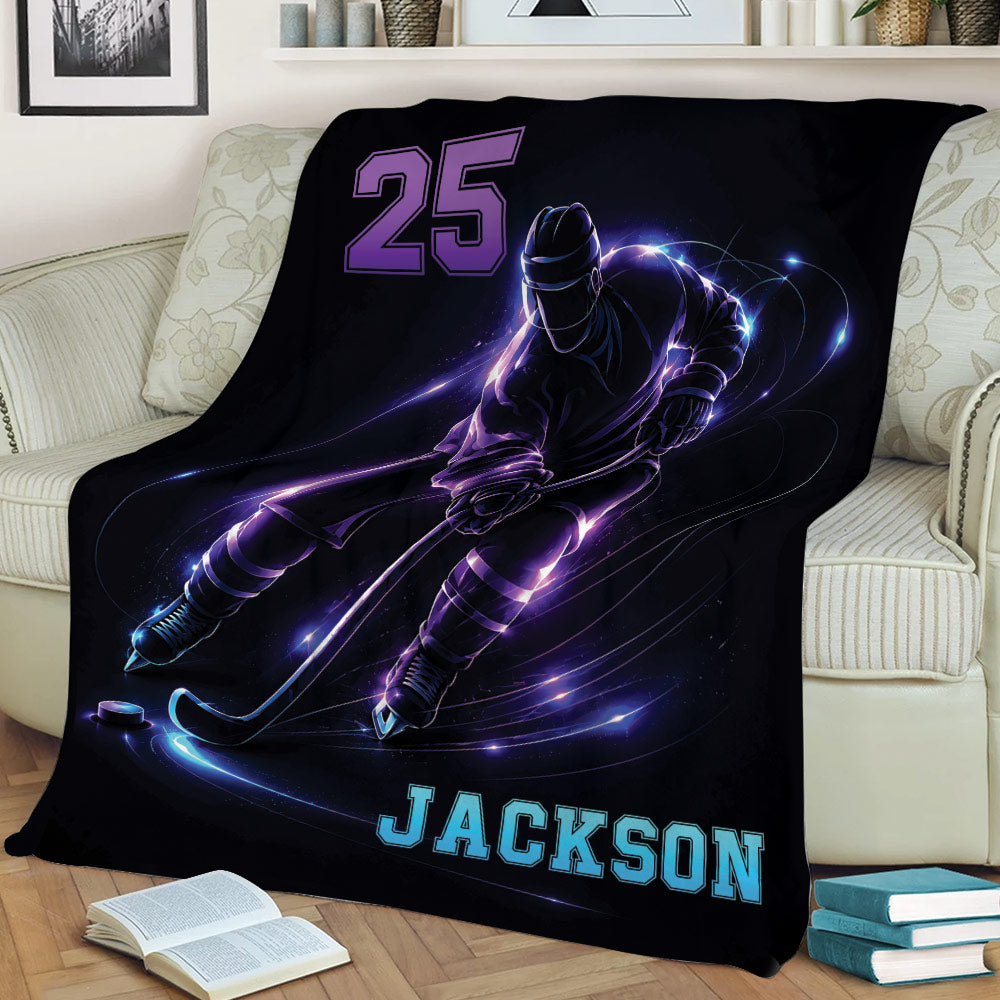 Black hockey throw blanket draped over a couch with dynamic skating player artwork