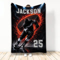 Custom hockey blanket featuring an ice hockey player skating with a stick and puck amid fiery red and black artwork