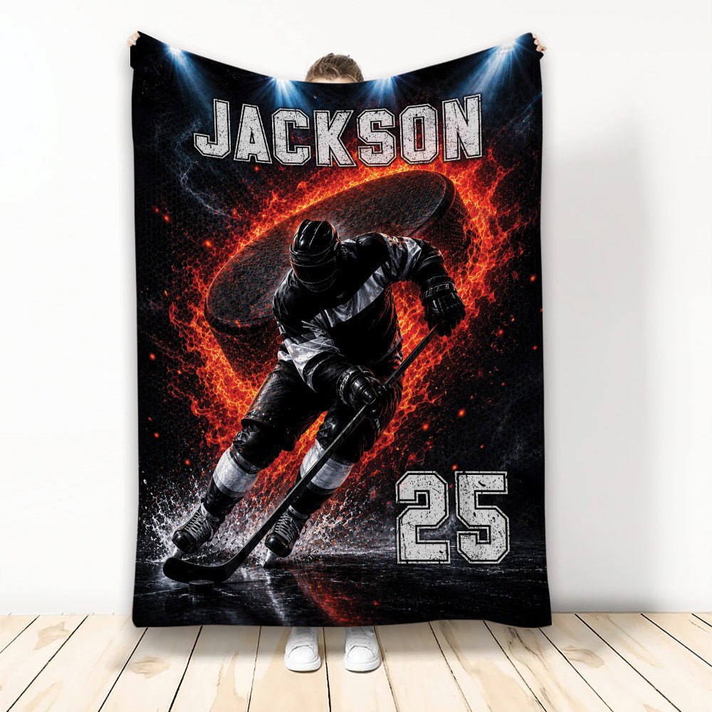 Custom hockey blanket featuring an ice hockey player skating with a stick and puck amid fiery red and black artwork