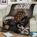 Close view of hockey throw blanket featuring distressed gear artwork, skates, gloves, stick and puck