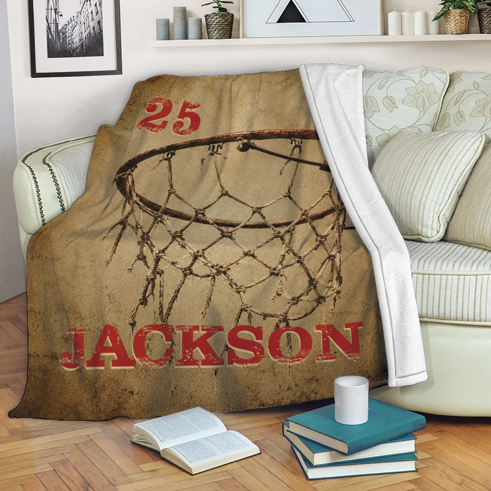 Vintage basketball throw blanket draped over a sofa with hoop and net artwork