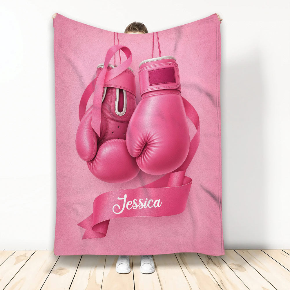 Pink breast cancer awareness throw blanket featuring boxing gloves and a pink ribbon design
